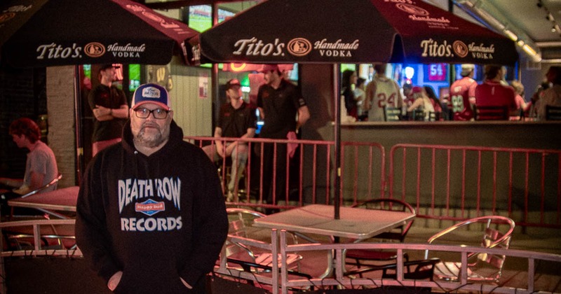 People outside at the entrance to the venue