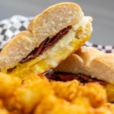 Breakfast sandwich with tater tots.