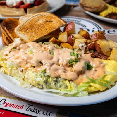 Mac Daddy Omelette, topped with Thousand Island dressing.