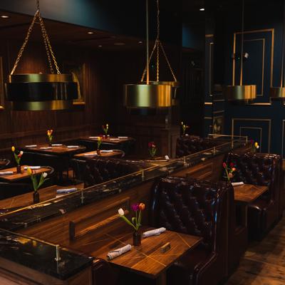 Interior, wide view of the dining area, fully set tables
