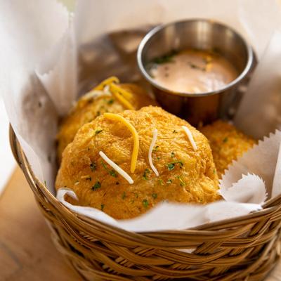 Fried yuca root balls served with a dip