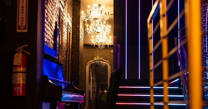 Interior, piano, chair, stairs behind