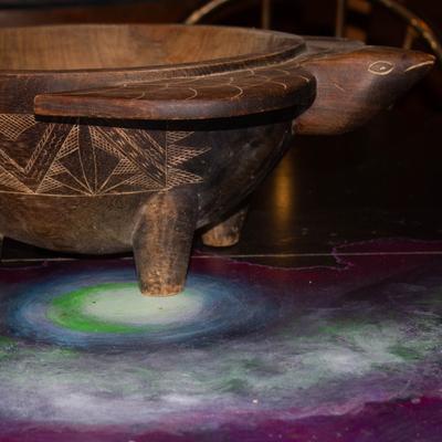 A turtle-shaped container on a table.