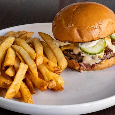 Ivy burger with side fries.