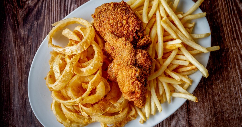 Fried chicken with fries and onion rings