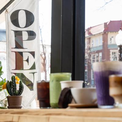 Assorted drinks on display and a view through the window.