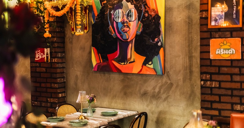 Interior, table with chairs with picture on the wall