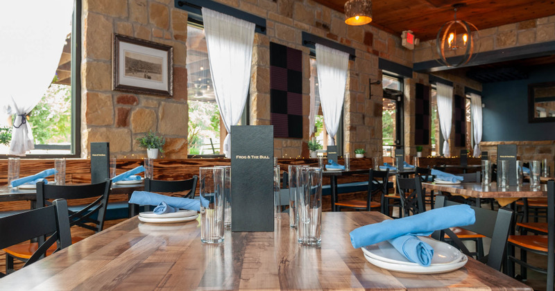 Interior, a dining table with glasses, menu and tableware, closeup