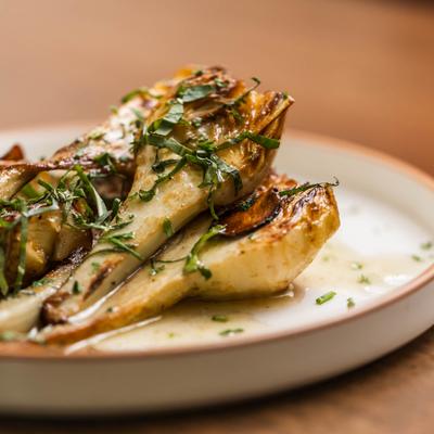 Crispy artichokes with garlic chips, mint, and yuzu.