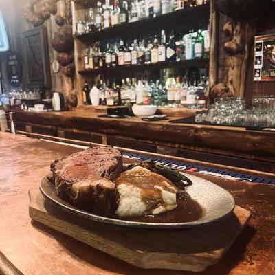 Prime Rib dinner with mashed potatoes and green beans.