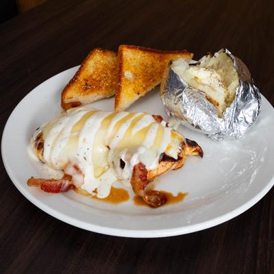 Grilled chicken breast topped with bacon, mushrooms, BBQ sauce and provolone.