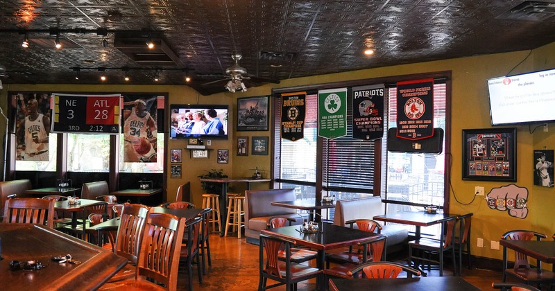 Interior, dining area, basketball posters, sports pictures and team banners on walls and windows