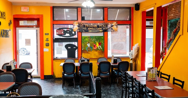 Interior, dining area, tables with chairs ready for guests, restaurant entrance, shop windows