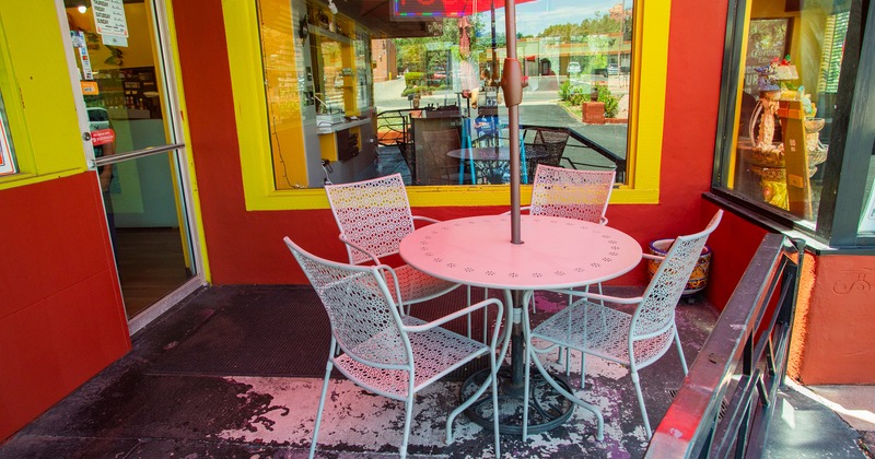 Outdoor seating area in front of the restaurant's entrance