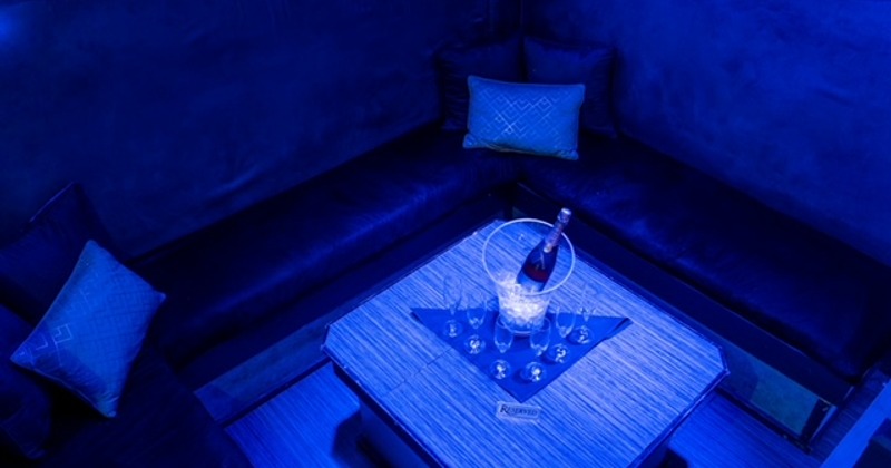 Corner booths with champagne in ice bucket