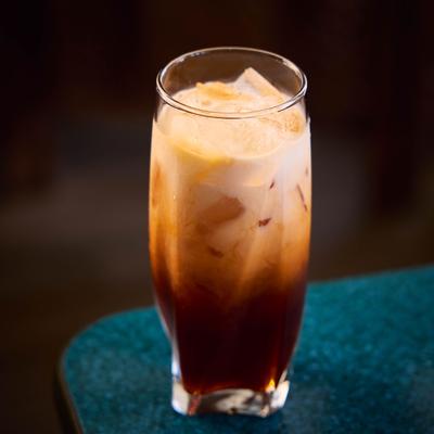 Glass of Thai Tea served over ice.