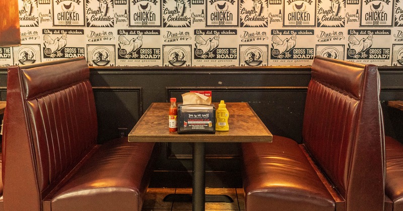 Interior, dining booth seating by a wall