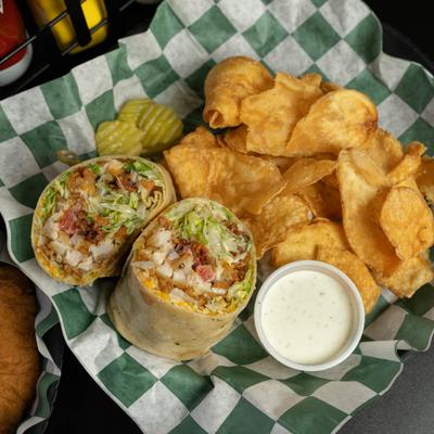 Chicken and Bacon Ranch Wrap served with chips and a dip.