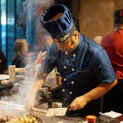 A cook preparing food.
