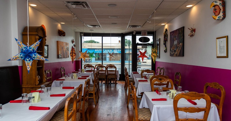 Dining tables set and decorated for a meal event