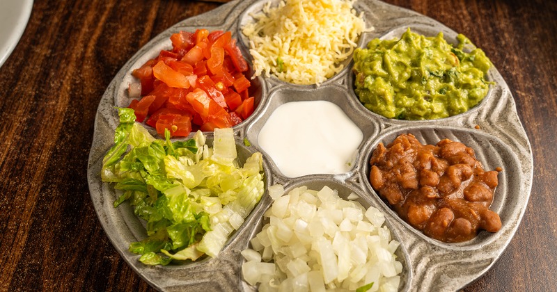 A platter with assorted Fajita toppings