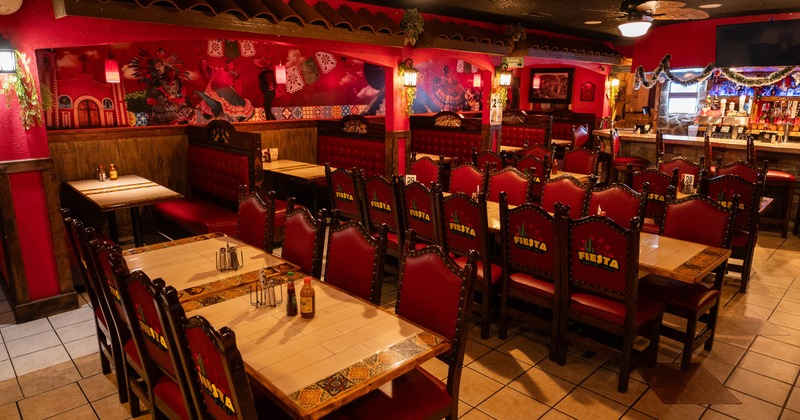 Interior, tables and chairs in dining area