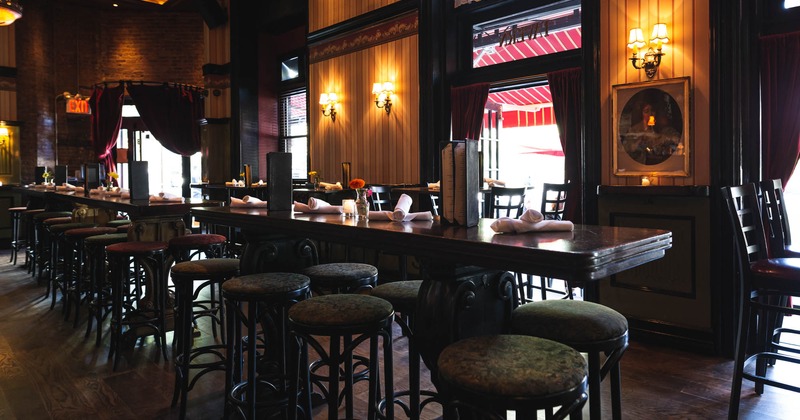 Interior, long decorated tables with bar stools