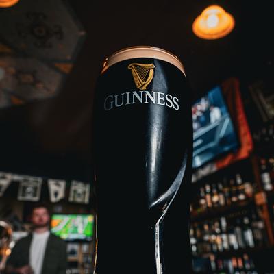 A glass of dark guinness beer.
