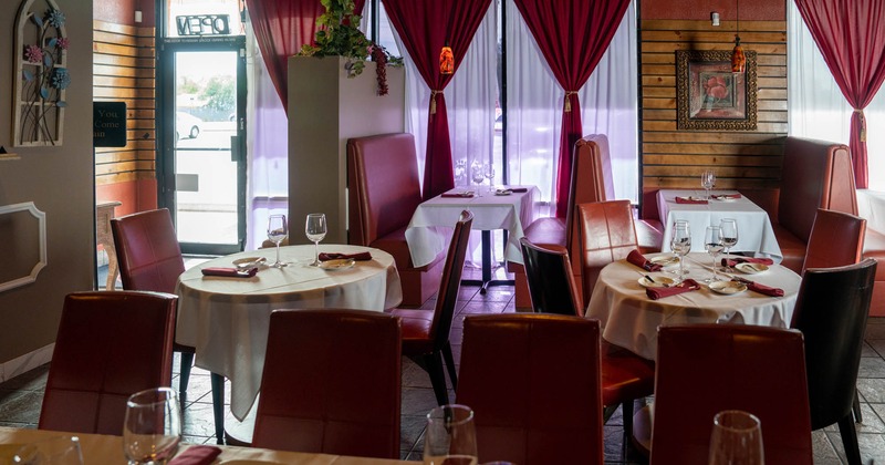 Interior, set tables, chairs, windows, curtains, exit doors