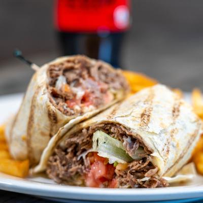 Close up of a Philly cheesesteak wrap.