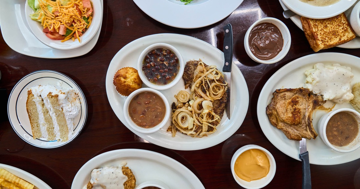 Overhead view of assorted comfort food dishes on a table