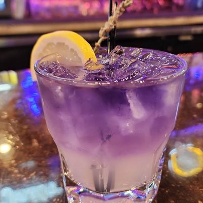Empress Lavender Lemonade, garnished with lemon slice and a lavender sprig.
