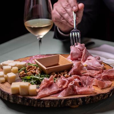 Charcuterie board with white wine.