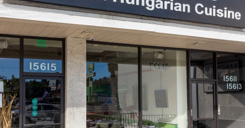 Exterior, front view to restaurant, entrance, sign above