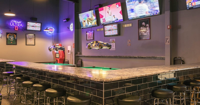 Interior, bar area with TVs on the wall