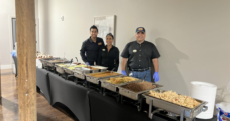 People preparing food in the containers