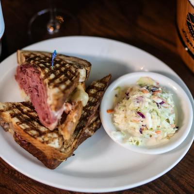 Commonwealth Avenue, Hot corned beef sandwich served with coleslaw and beer.