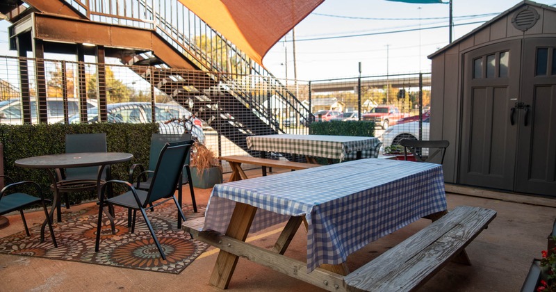 Exterior, wooden picnic table, chairs and table
