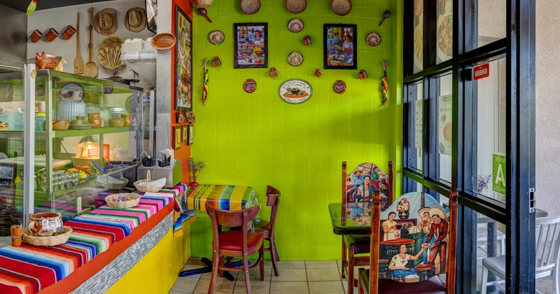Colorful chairs, tables, and wall decorations