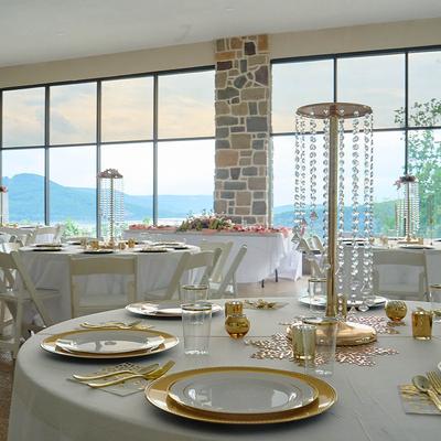 Table settings in a wedding reception room.
