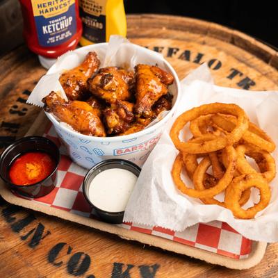 Buffalo chicken wings, onion rings, and dipping sauces.