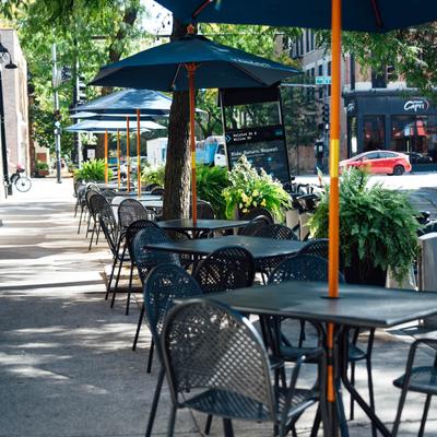 Sidewalk cafe, potted outdoor plants, parasols