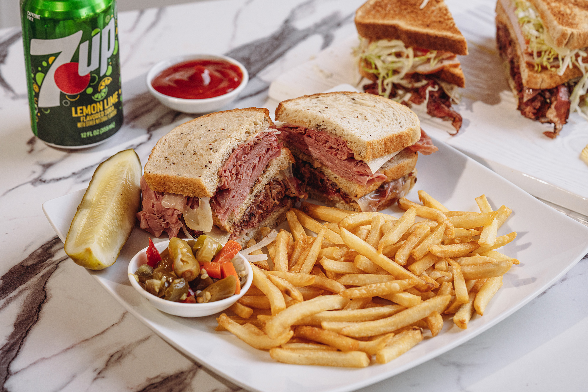 Served sandwiches with dips and fries