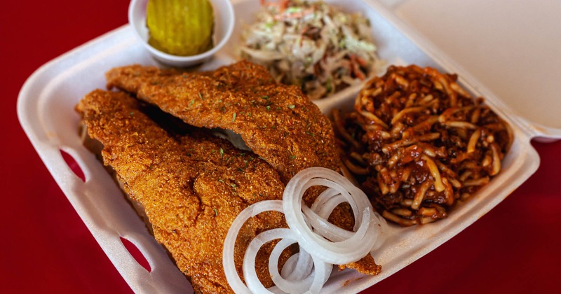 Fried fish, with spaghetti, and coleslaw