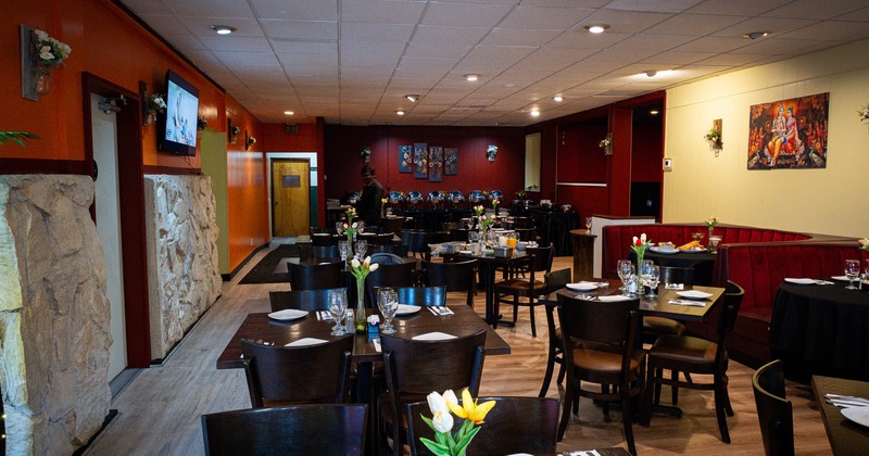 Interior, tables and chairs in dining area