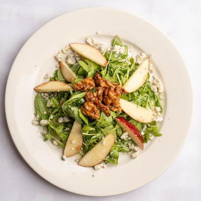 Arugula Salad, with apples, candied walnuts, gorgonzola cheese, truffle oil, and lemon.
