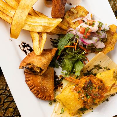 A plate of assorted Latin American food.