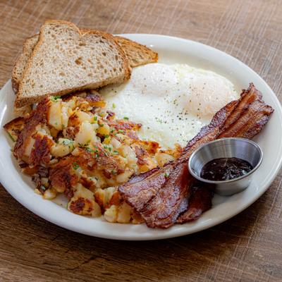 Egg Combo served with bacon, potatoes, and toast.