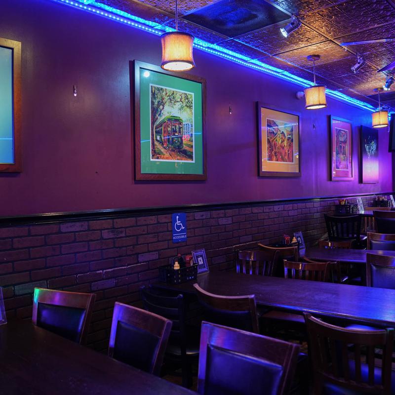 Interior, tables, framed artwork, decorative ceiling panels