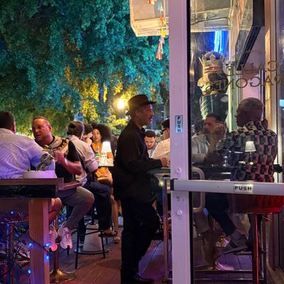People at the terrace at night.